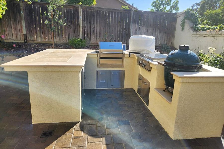 backyard outdoor kitchen with grill and countertop