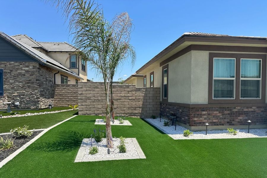 Artificial grass landscaping in residential backyard